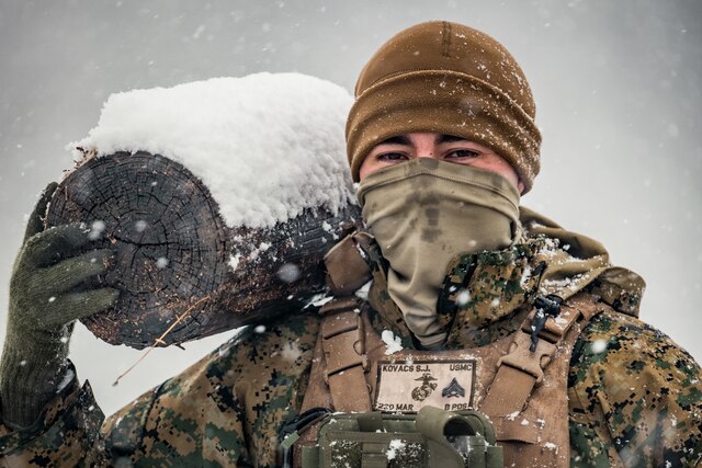 A Marine Combat Engineer sets off a satchel charge that blasts a