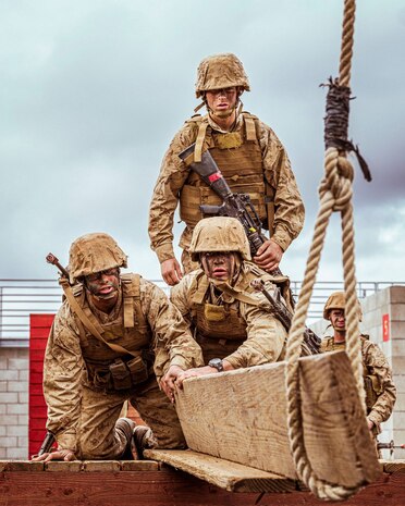 U.S. Marine Corps recruits with Alpha Company, 1st Recruit Training Battalion, participate in an obstacle challenge on Marine Corps Base Camp Pendleton, California, Dec. 29, 2021.