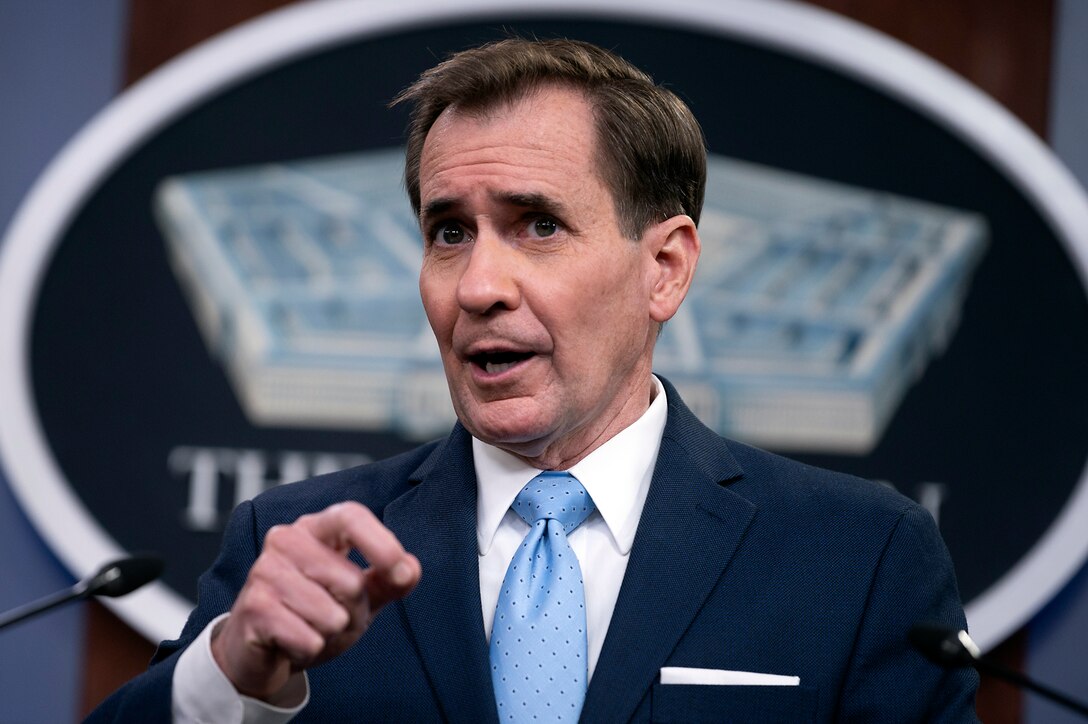 A man speaks at a press briefing.