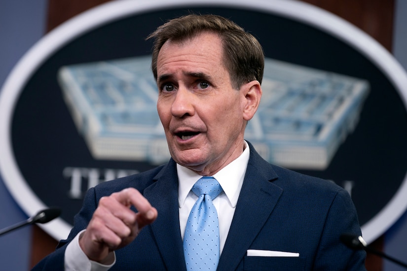 A man speaks at a press briefing.