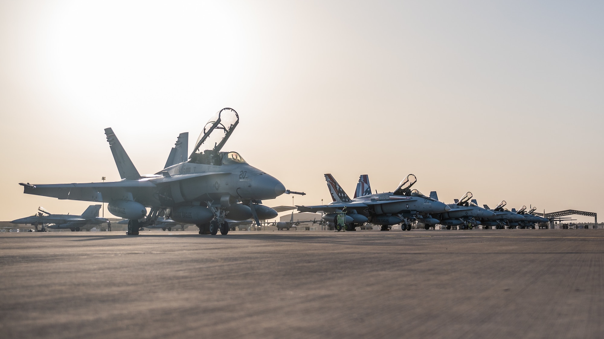 U.S. Marine F/A-18 Hornets from the Marine Fighter Attack Squadron 115 sit on the flight line at Prince Sultan Air Base, Kingdom of Saudi Arabia, Dec. 23, 2021. The arrival of the VMFA-115 is a key addition to PSAB as it prepares and postures U.S. and coalition forces to span the full range of combat effectiveness. (U.S. Air Force photo by Senior Airman Jacob B. Wrightsman)