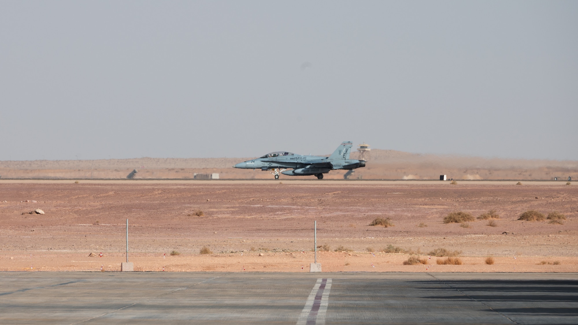An F/A-18 Hornet lands at Prince Sultan Air Base, Kingdom of Saudi Arabia, Dec. 23, 2021. Marines from the Marine Fighter Attack Squadron 115 deployed to PSAB to maximize regional capabilities in regards to mutual security concerns. (U.S. Air Force photo by Senior Airman Jacob B. Wrightsman)