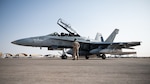 A U.S. Marine F/A-18 Hornet sits on the flight line at Prince Sultan Air Base, Kingdom of Saudi Arabia, Dec. 23, 2021. The arrival of the Marine Fighter Attack Squadron 115 improves the ability of the Combined Forces Air Component Commander to move forces fluidly across the theatre. (U.S. Air Force photo by Senior Airman Jacob B. Wrightsman)