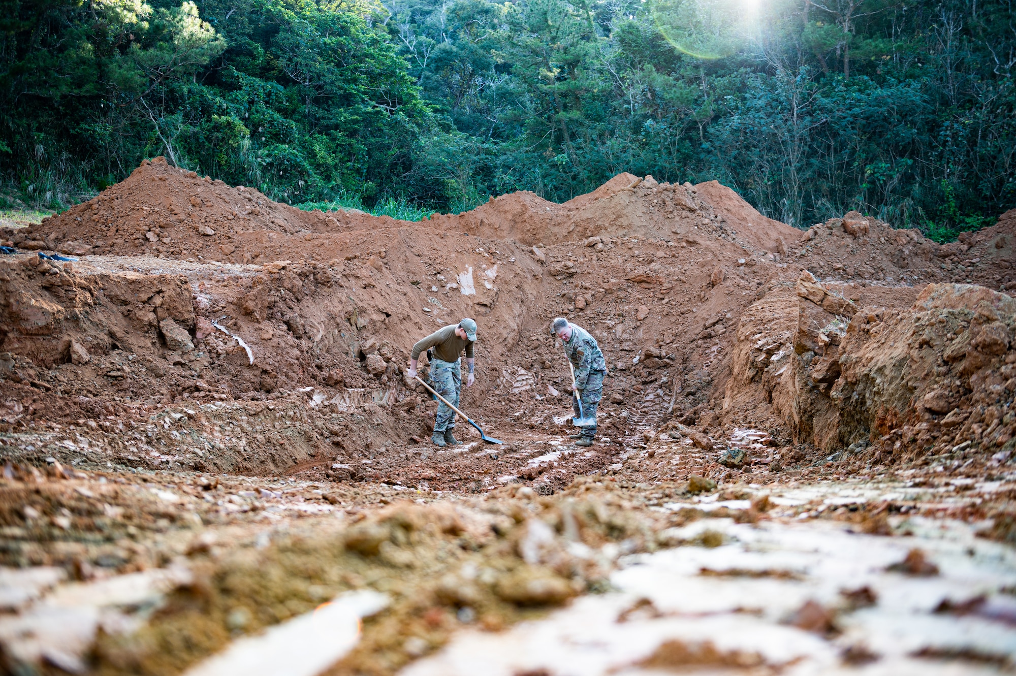 Explosive ordnance disposal Airmen prepare a detonation site.