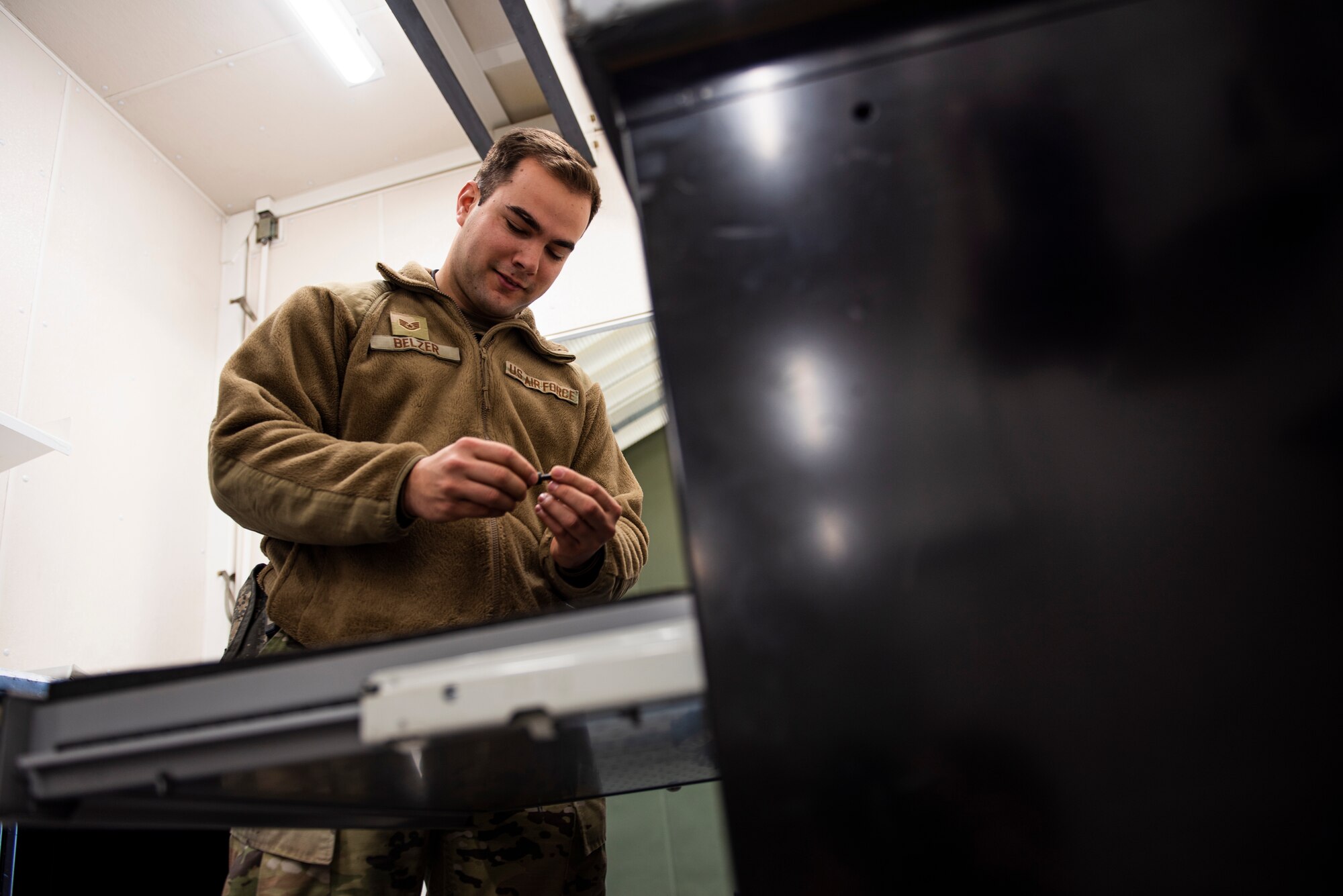 Staff Sgt. Patrick Belzer, a special weapons technician assigned to the 39th Maintenance Squadron, inspects maintenance equipment at Incirlik Air Base, Turkey, Dec. 21, 2021.