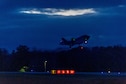 This is a photograph of an F-35A Lightning II taking off from the Vermont Air National Guard base during a routine night training mission in South Burlington, Vt., Nov. 16, 2021.