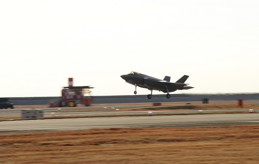 A jet takes off from a runway.