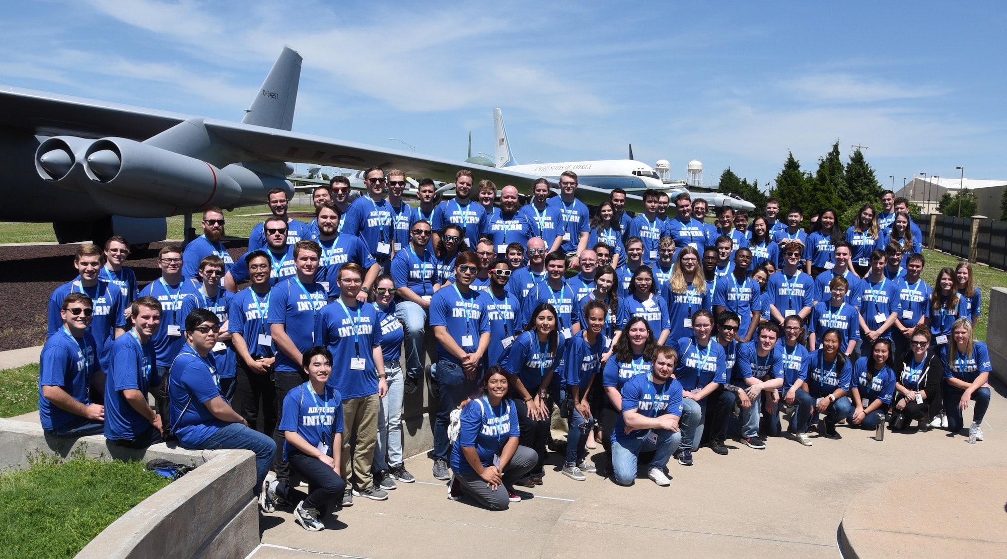 Student interns participating in the Air Force’s Premier College Intern Program pause for a photo at the Maj. Charles B. Hall Memorial Air Park after touring Tinker Air Force Base, Okla., in June 2019. PCIP is designed to attract high-caliber candidates currently enrolled full time in college who are seeking a career with the Air Force Civilian Service. The Air Force Life Cycle Management Center Contracting Directorate - Operating Location Hanscom has been allocated six PCIP internships for fiscal year 2022 for placement in their operational contracting division. (U.S. Air Force photo by Ron Mullan)