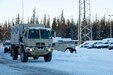 A Light Medium Tactical Vehicle and a High Mobility Multipurpose Wheeled Vehicle leaves the Alaska National Guard Armory on Joint Base Elmendorf-Richardson, Alaska, for transport to the Alcantra Armory in Wasilla, Jan. 5. The LMTV and HMMWV have been assigned to Alaska Army National Guard's 297th Regional Support Group to provide direct support to the Matsu-Borough after high winds have led to infrastructure damage, power outages, and dangerous transportation conditions. (U.S. Army National Guard photo by Victoria Granado)