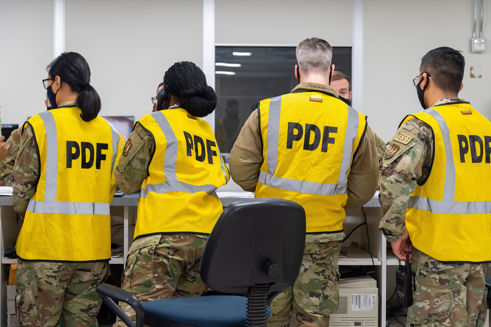 Members of the Personnel Deployment Function line verify Airmen's eligibility to deploy during the Operation Alert Jackal deployment readiness exercise on Edwards Air Force Base, California, Nov. 30. (Air Force photo by Chloe Bonaccorsi)