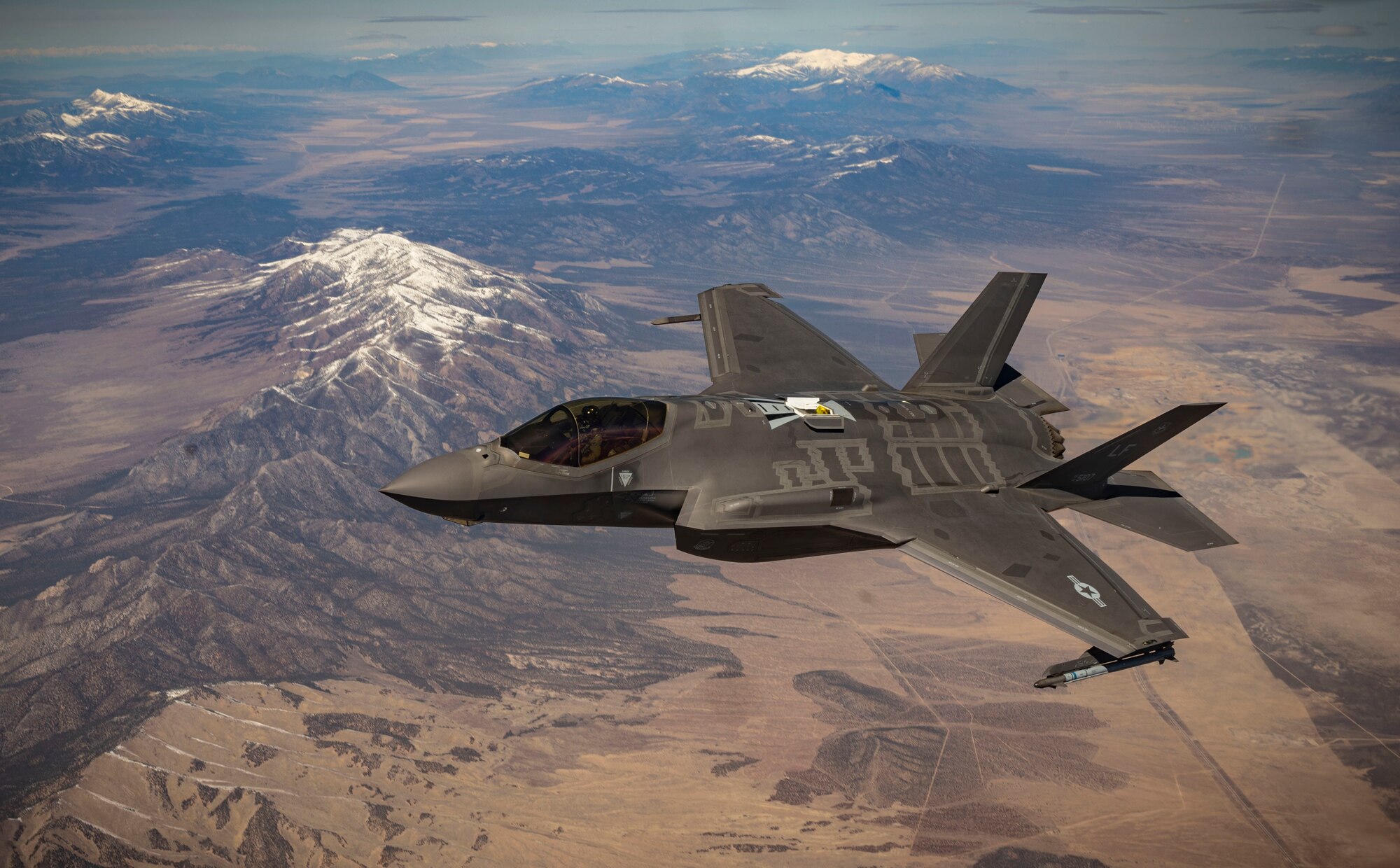 An F-35 Lightning II assigned to the 62nd Fighter Squadron at Luke Air Force Base, Ariz., flies over the Nevada Test and Training Range