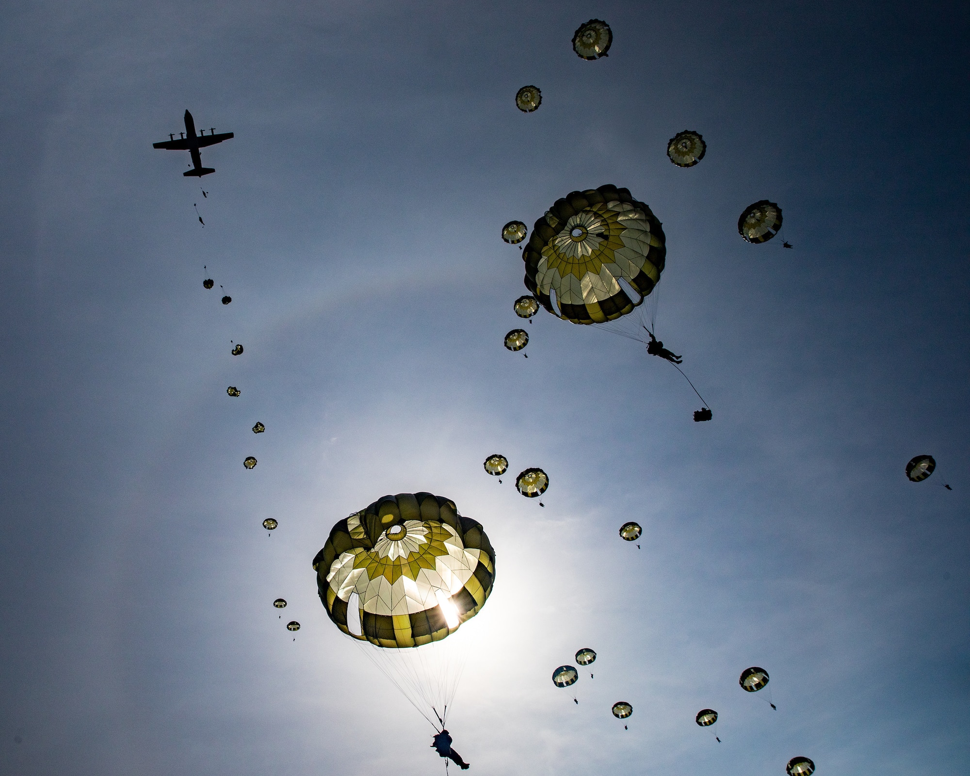 A U.S. Air Force C-130J Super Hercules drops Japanese soldiers