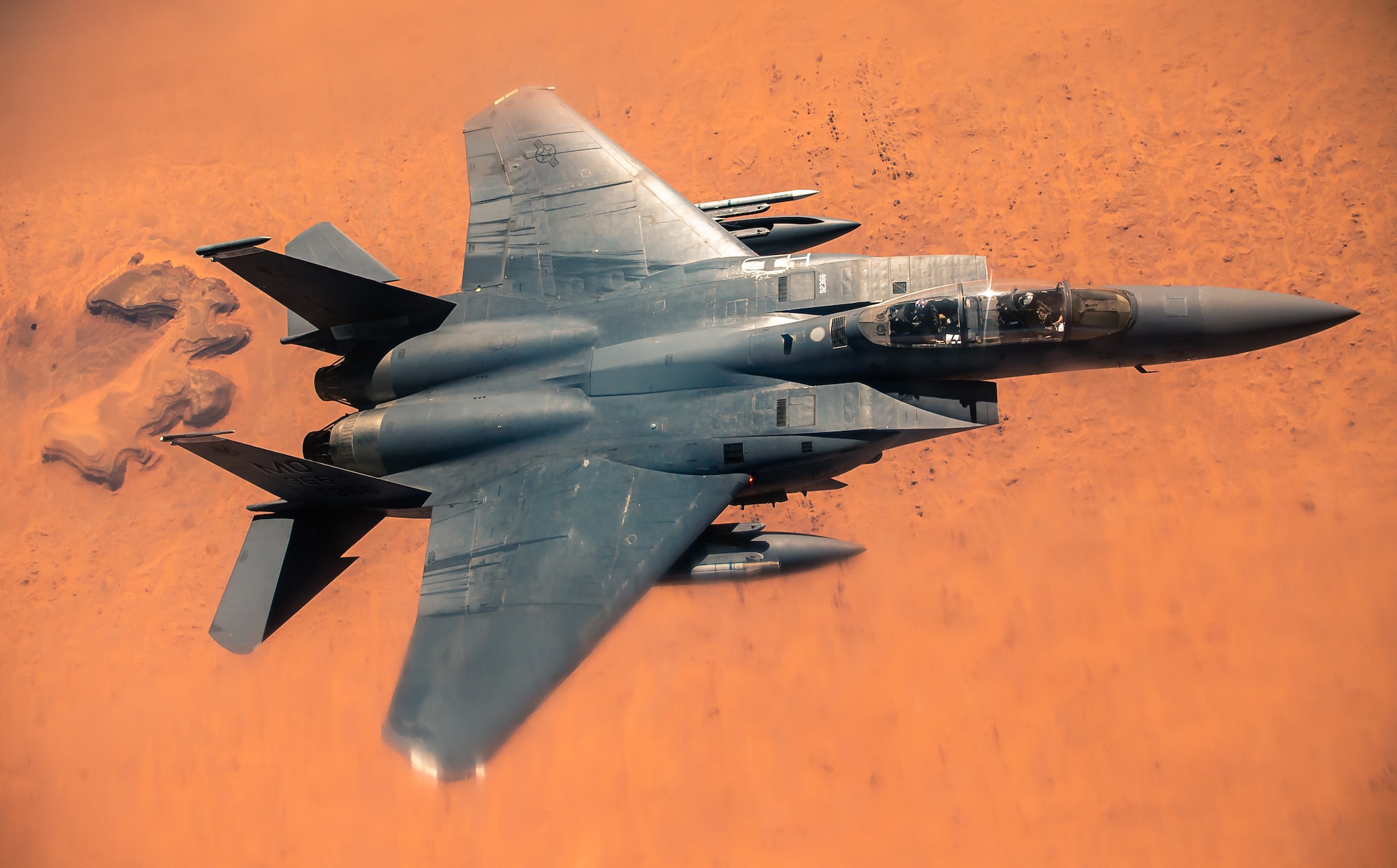 An F-15E Strike Eagle departs after receiving fuel