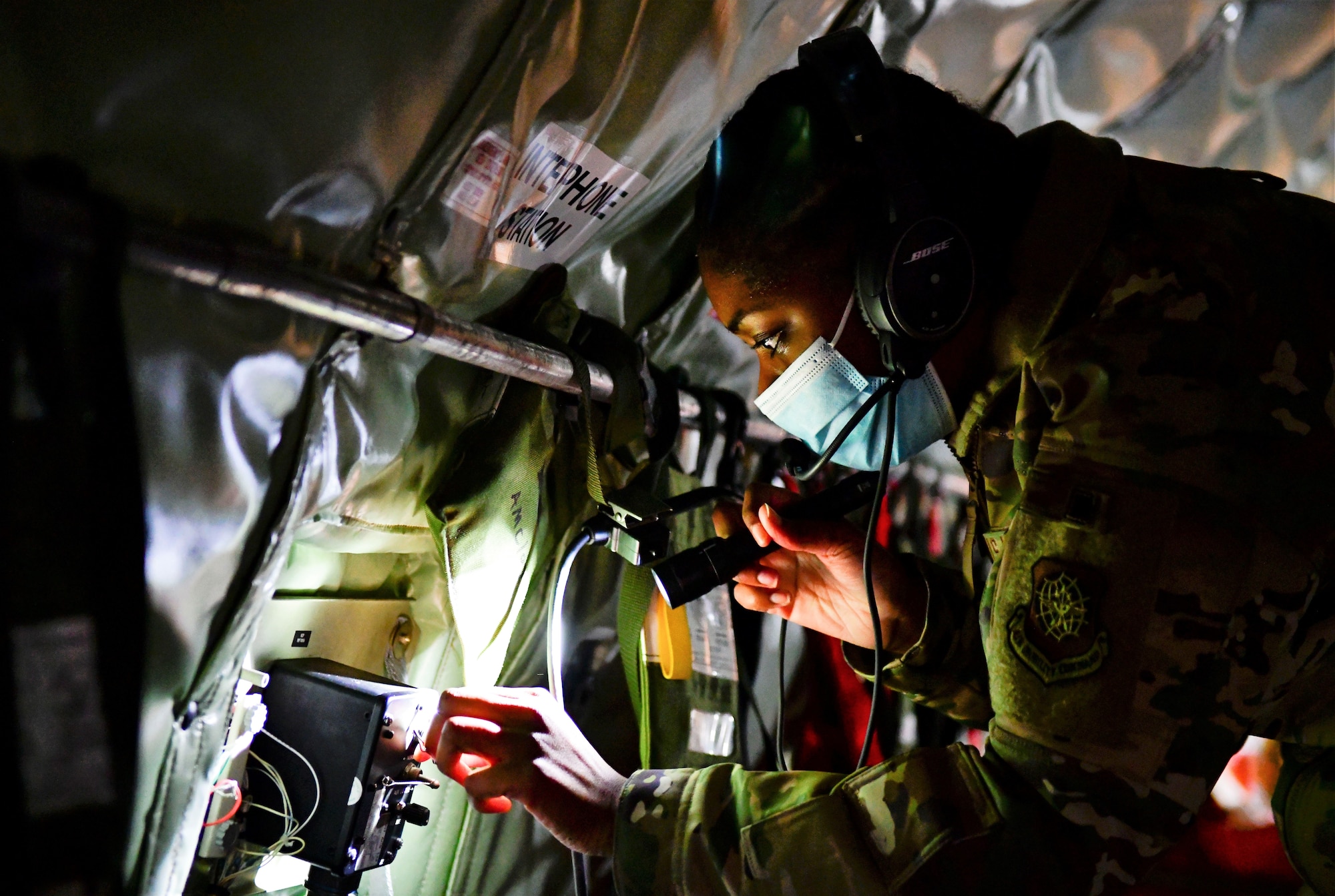 Airman Legea Howard, 384th Air Refueling Squadron boom operator, performs preflight checks
