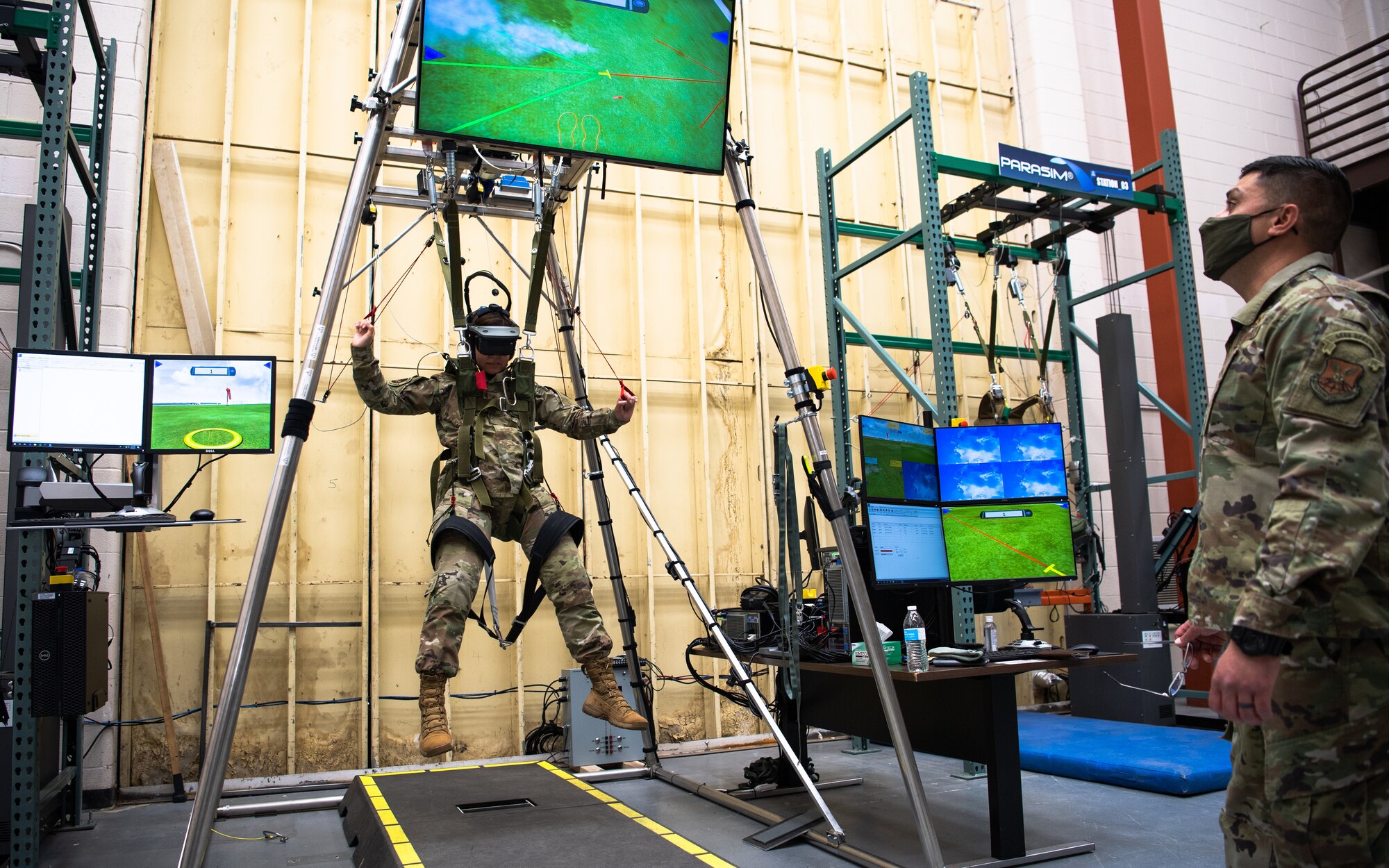 Chief Master Sgt. of the Air Force JoAnne S. Bass uses the 2nd Operational Support Squadron’s parachute simulator