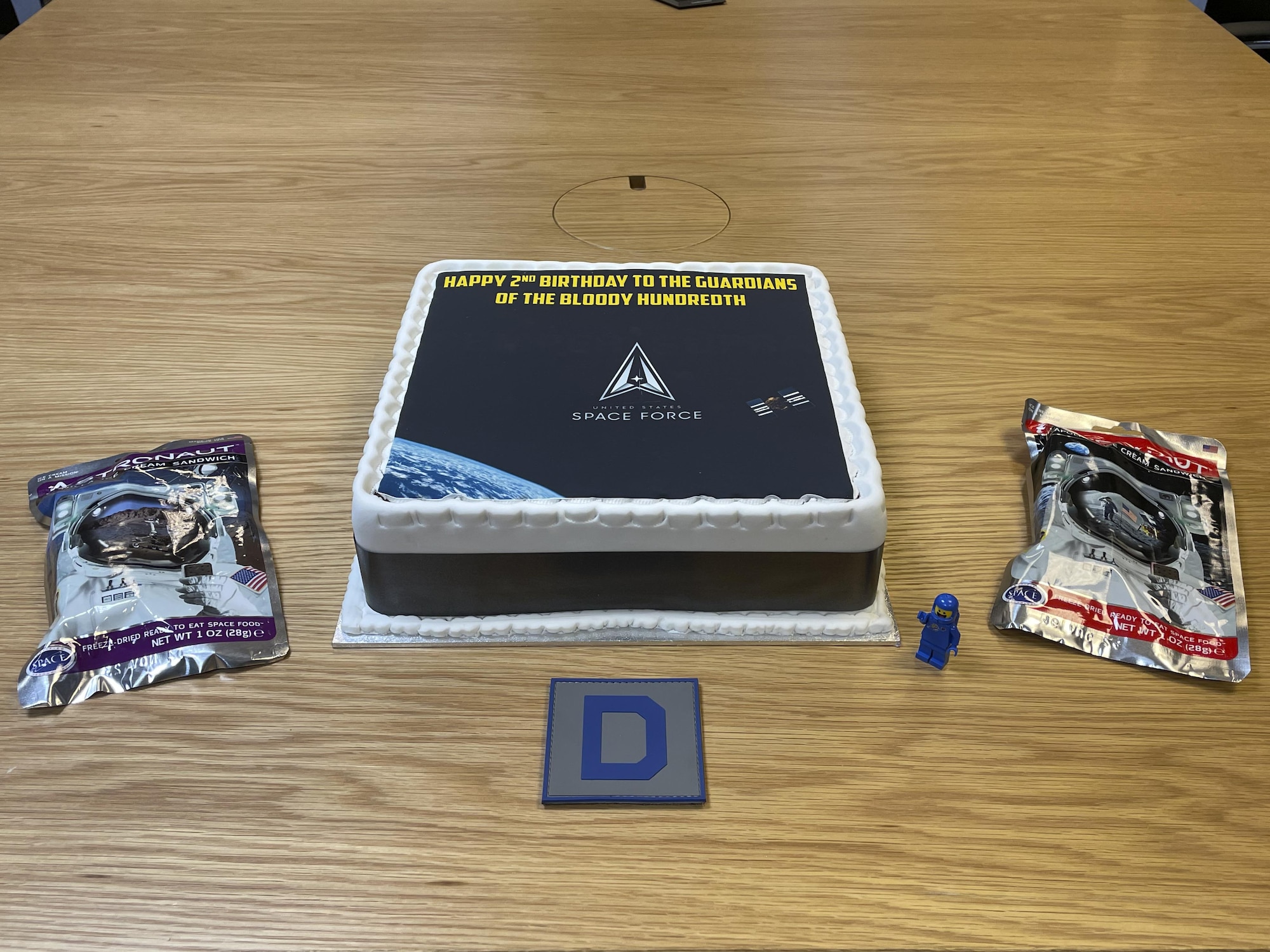 Members of the 100th Air Refueling Wing celebrated the U.S. Space Force’s second birthday with cake and astronaut ice cream sandwiches at Royal Air Force Mildenhall, England, Dec. 20, 2021. The Space Force is part of the Department of the Air Force and is the youngest branch of the U.S. military. (U.S. Air Force photo by Senior Airman Joseph Barron)