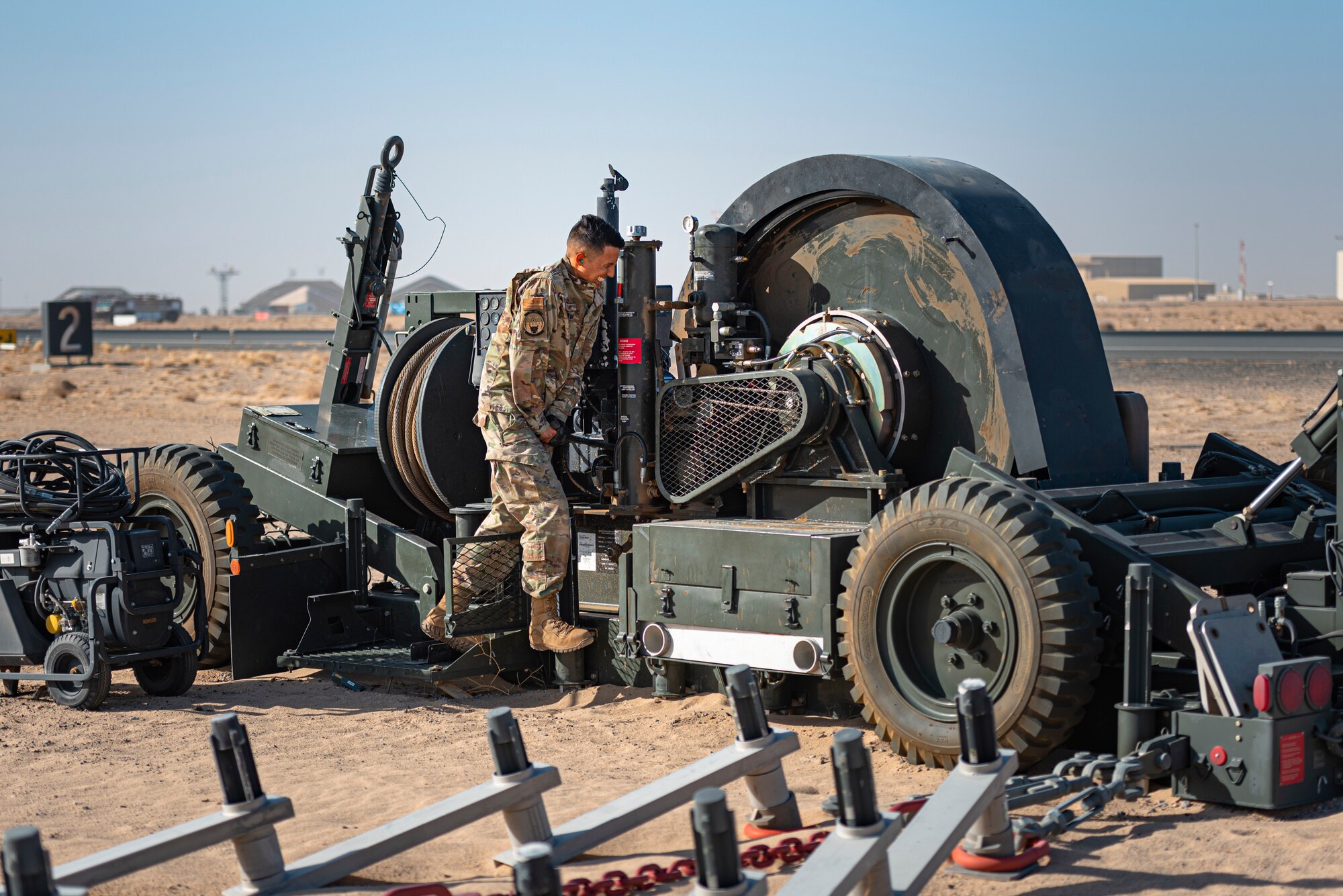 A photo of an airmen prepping flight line gear