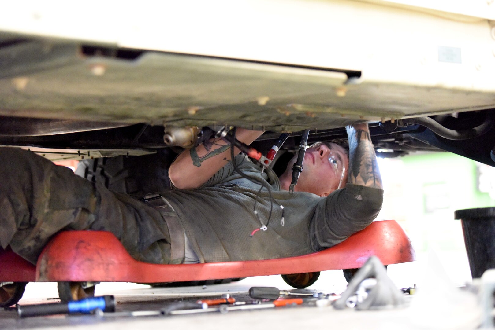 Michigan Army National Guard Sgt. Michael Hamel, vehicle mechanic with the Unit Training Equipment Site (UTES) and a member of the 156th Expeditionary Signal Battalion, conducts maintenance on a Humvee at Fort Custer Training Center, Augusta, Michigan, Dec. 16, 2021.