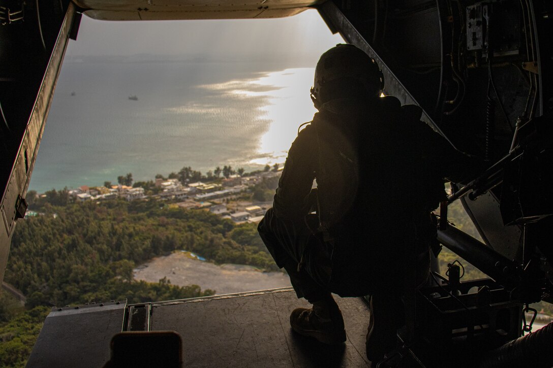 A U.S. Marine with Marine Medium Tiltrotor Squadron 265, 31st Marine Expeditionary Unit, flies in an MV-22B Osprey during MEU exercise on Camp Hansen, Dec. 17, 2021. MEUEX is a pre-deployment training exercise that validates and reinforces the MEU’s mission capabilities across all of the Marine subordinate elements. The 31st MEU, the Marine Corps’ only continuously forward-deployed MEU, provides a flexible and lethal force ready to perform a wide range of military operations as the premier crisis response force in the Indo-Pacific region.