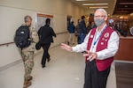 John Scanlon greets staff members as they arrive at Brooke Army Medical Center