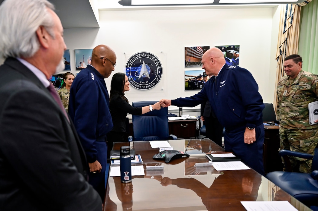Under Secretary of the Air Force Gina Ortiz Jones greets Chief of Space Operations Gen. John W. "Jay" Raymond during a meeting with senior Air Force and Space Force leaders