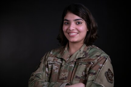 Senior Airman Jibiliya Ann poses for a feature photograph to go with a written article, "Beyond the Call of Duty".