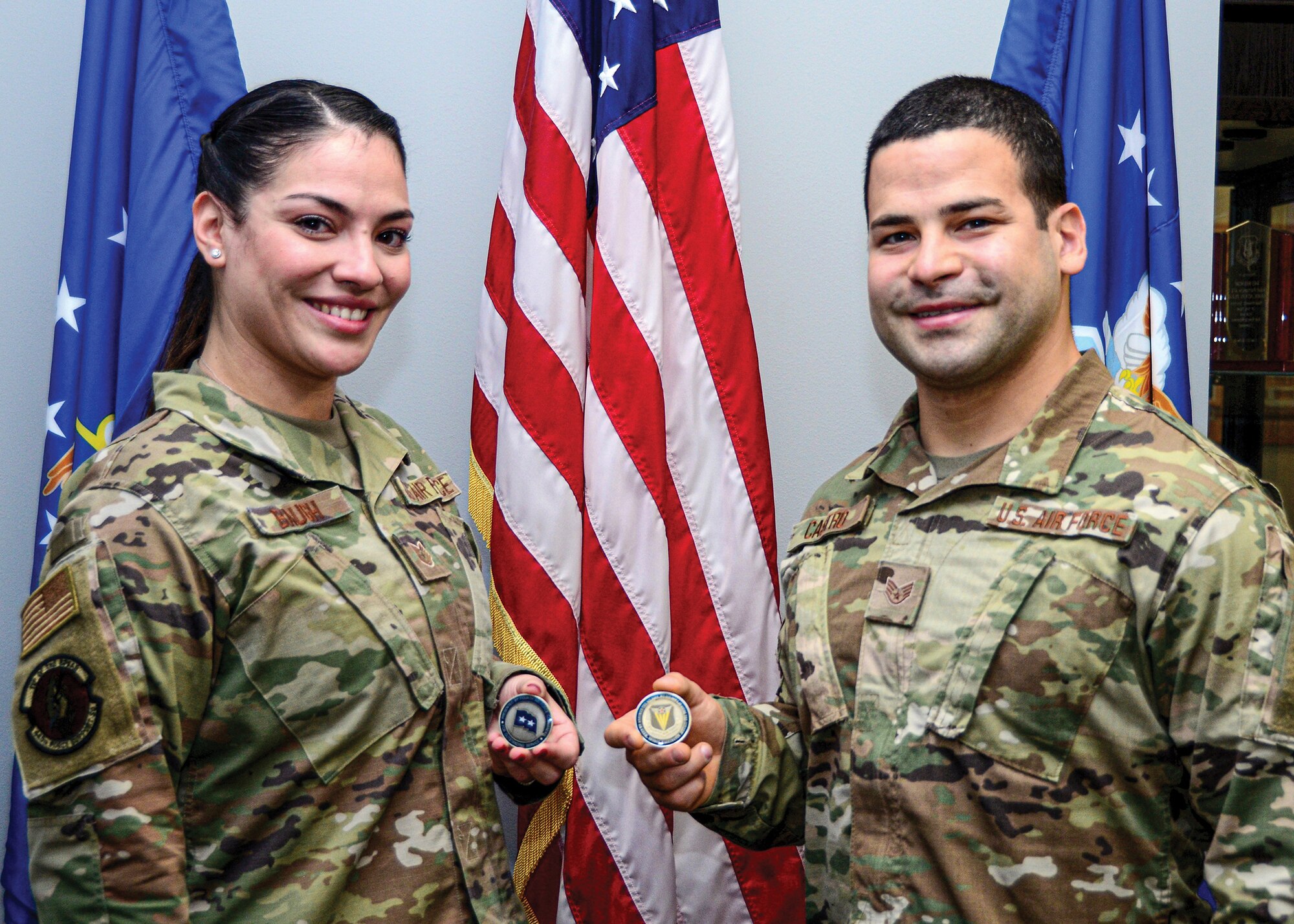 Siblings Tech. Sgt. Roselys Baugh, 445th Force Support Squadron NCO in charge of force management, and, Staff Sgt. Melvin Castro, 445th Aerospace Medicine Squadron NCO in charge of immunization, were both coined during the November unit training assembly by 4th Air Force commander, Maj. Gen. Jeffrey T. Pennington, for being outstanding performers selected by their respective units.