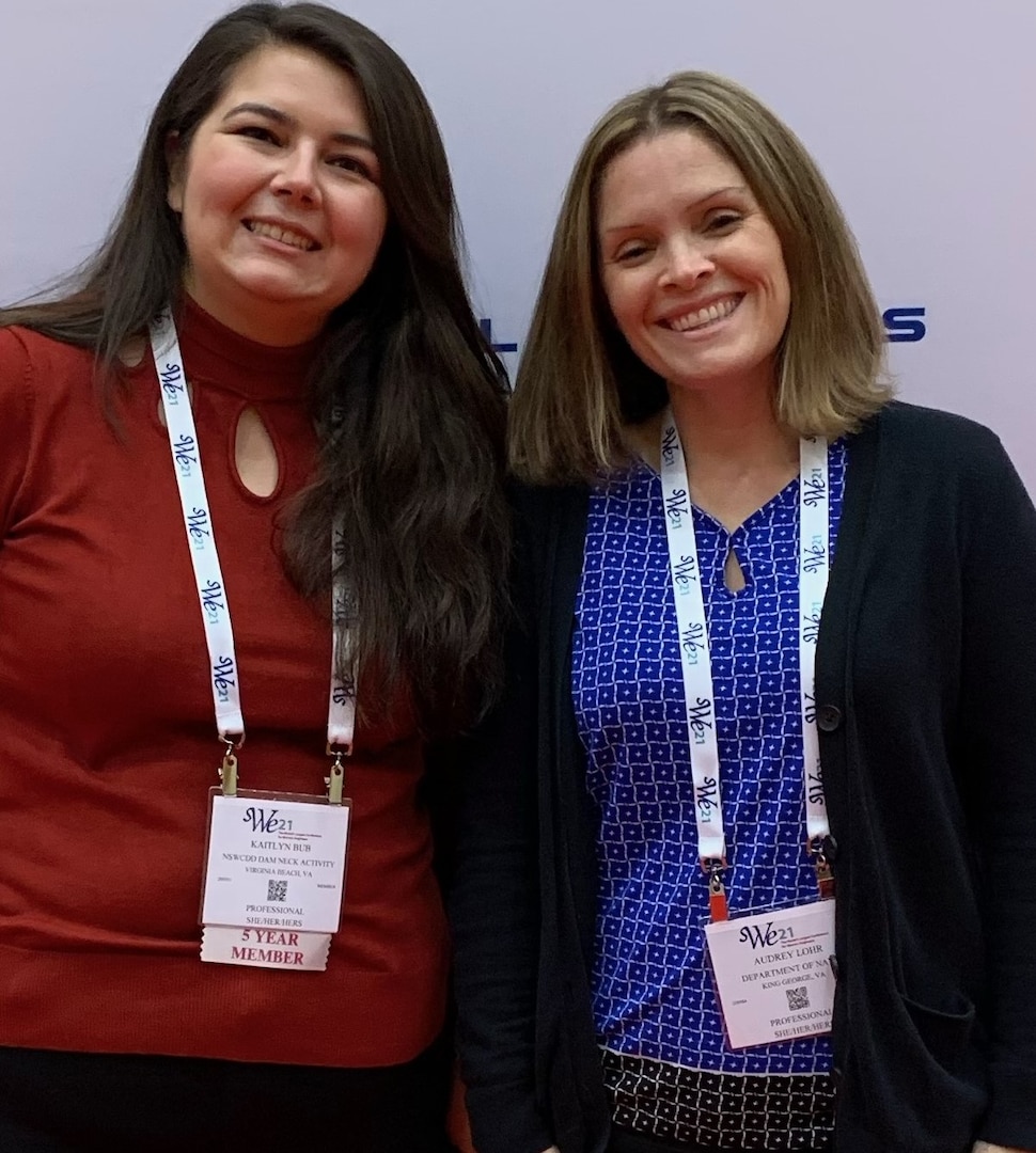 IMAGE: Naval Surface Warfare Center Dahlgren Division engineers Kaitlyn Bub (left) and Audrey Lohr (right) pose for a photo at the 2021 Society of Women Engineers Conference.