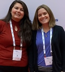 IMAGE: Naval Surface Warfare Center Dahlgren Division engineers Kaitlyn Bub (left) and Audrey Lohr (right) pose for a photo at the 2021 Society of Women Engineers Conference.