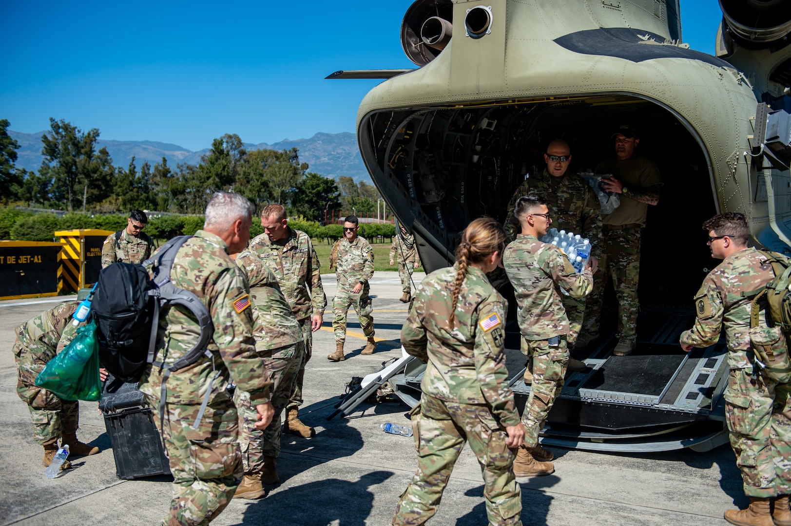 Members of Joint Task Force Bravo unload a CH-47 Chinook at the Guatemalan 5th Infantry Brigade near Huehuetenango, Guatemala, Dec. 11, 2021.