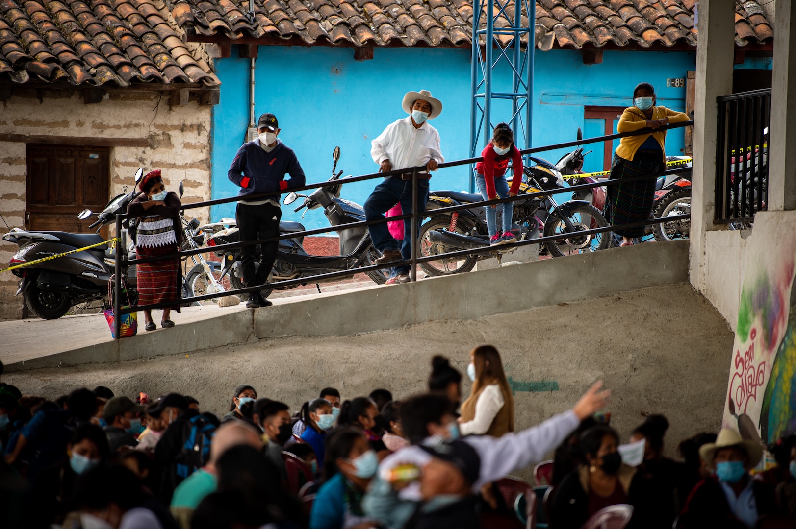 Guatemalan citizens watch over a global health engagement conducted by members of Joint Task Force Bravo in Aquacatan, Guatemala, Dec. 16, 2021.