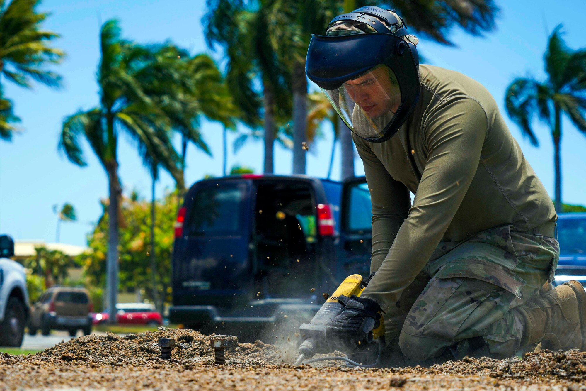 Senior Airman Gabriel Packwood, 647th Civil Engineer Squadron structures journeyman, breaks up the top layer of a concrete