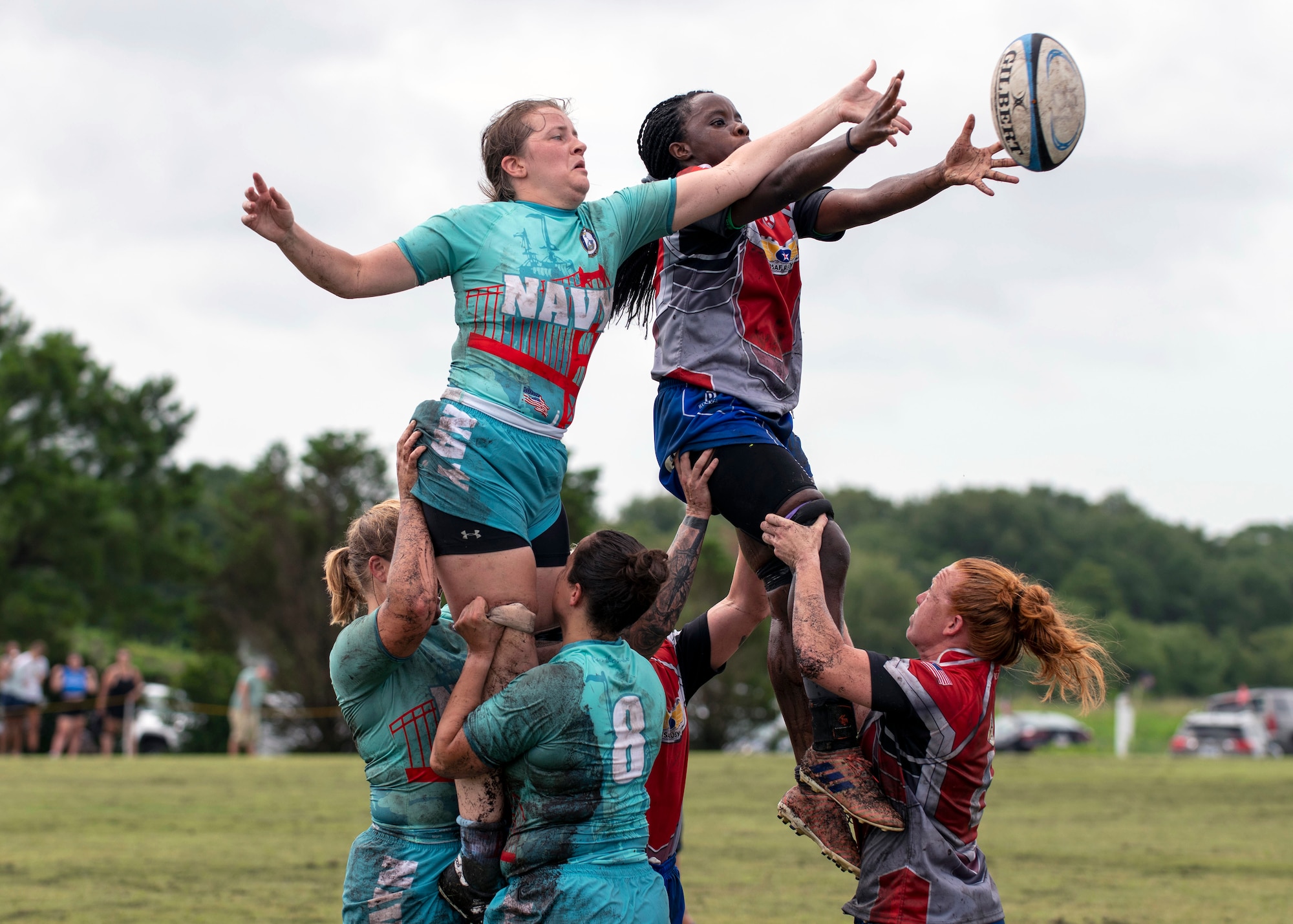 U.S. Air Force and U.S. Navy rugby players perform a lineout