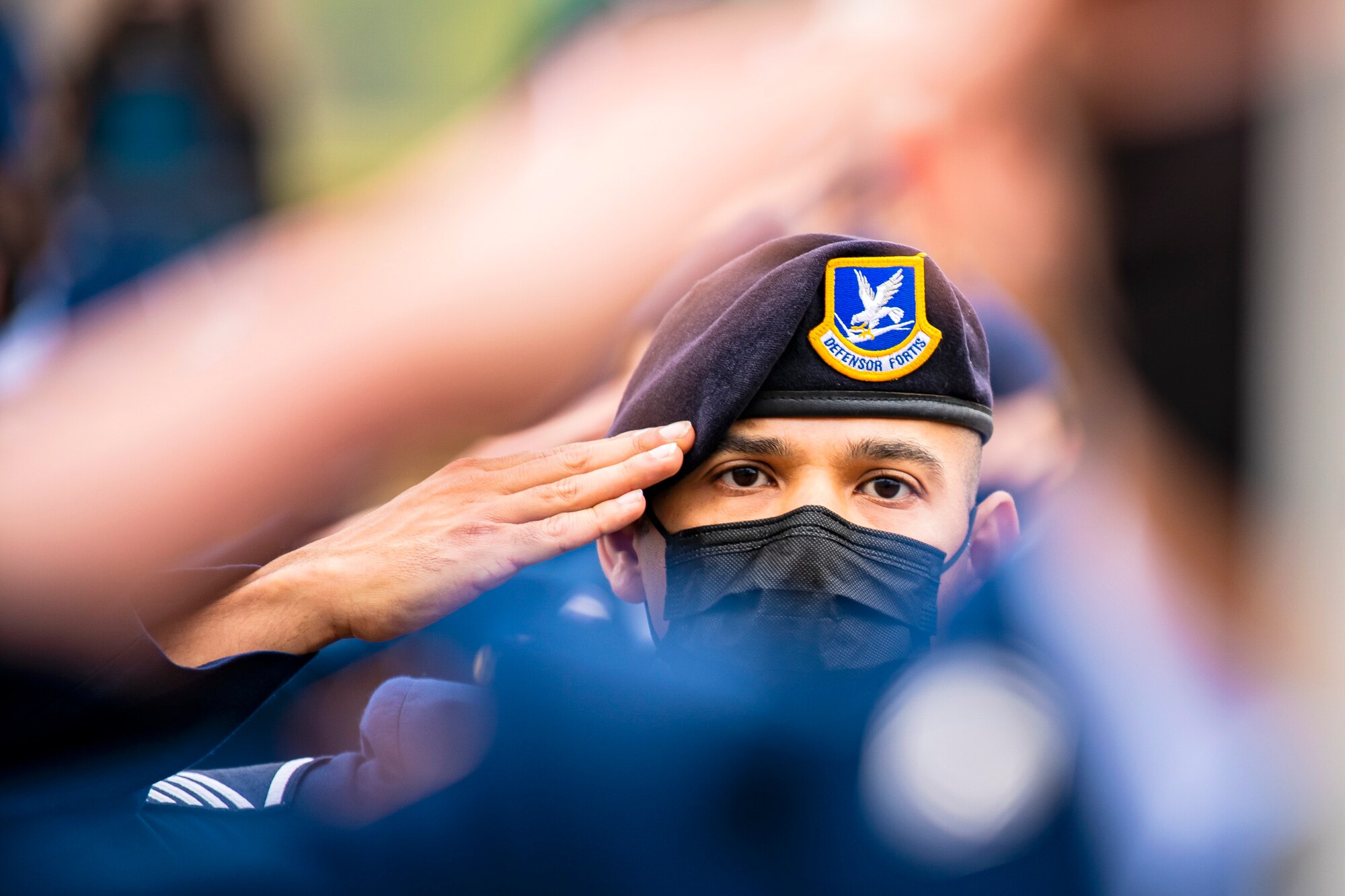 Master Sgt. Christian Navarro-Salazar, 423rd Security Forces Squadron supply and logistics superintendent, salutes during a 9/11 remembrance ceremony