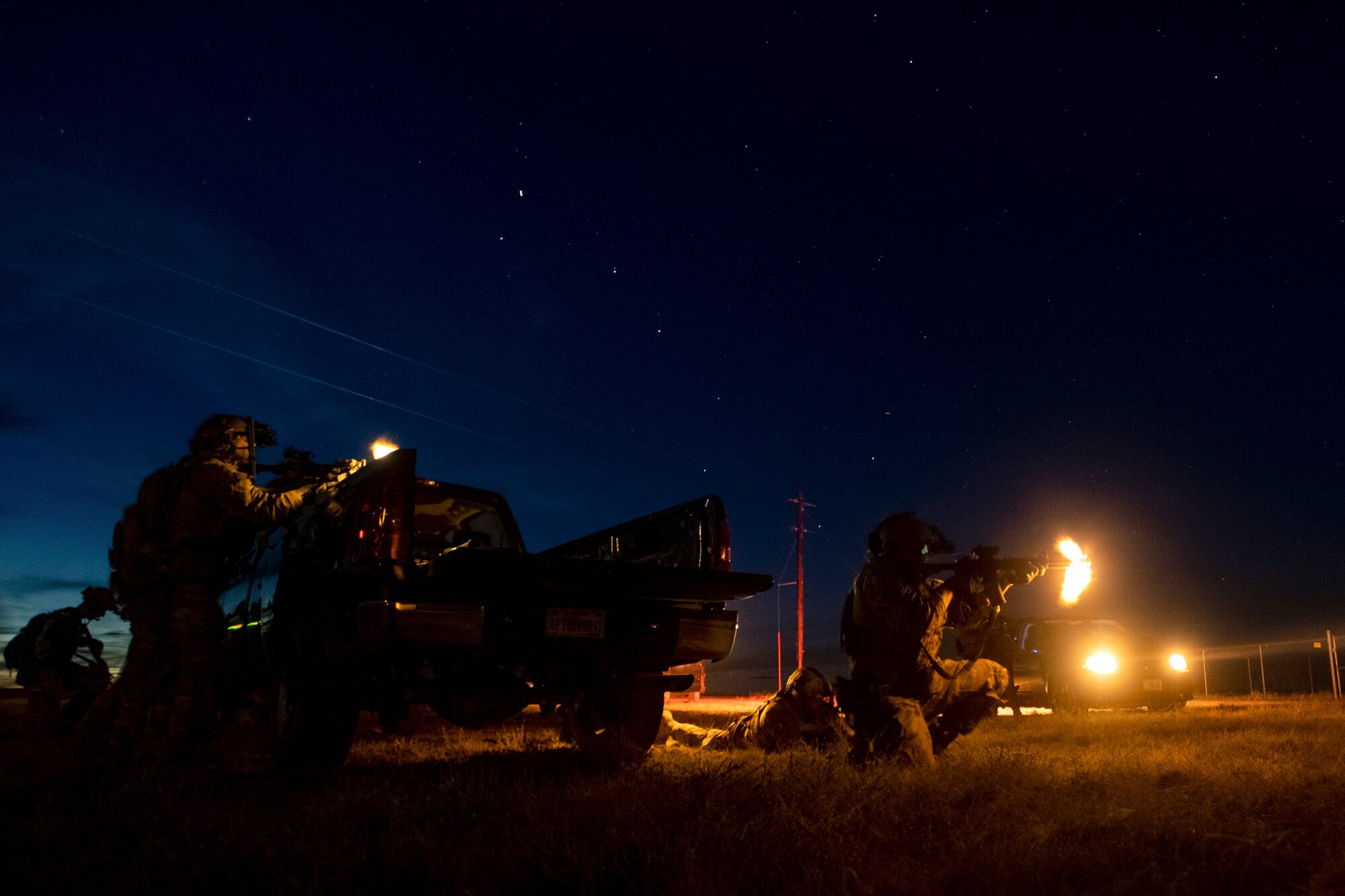 Airmen assigned to the 27th Special Operations Mission Support Group Mission Sustainment Team 1 and the 33rd Special Operations Squadron fire at a simulated enemy