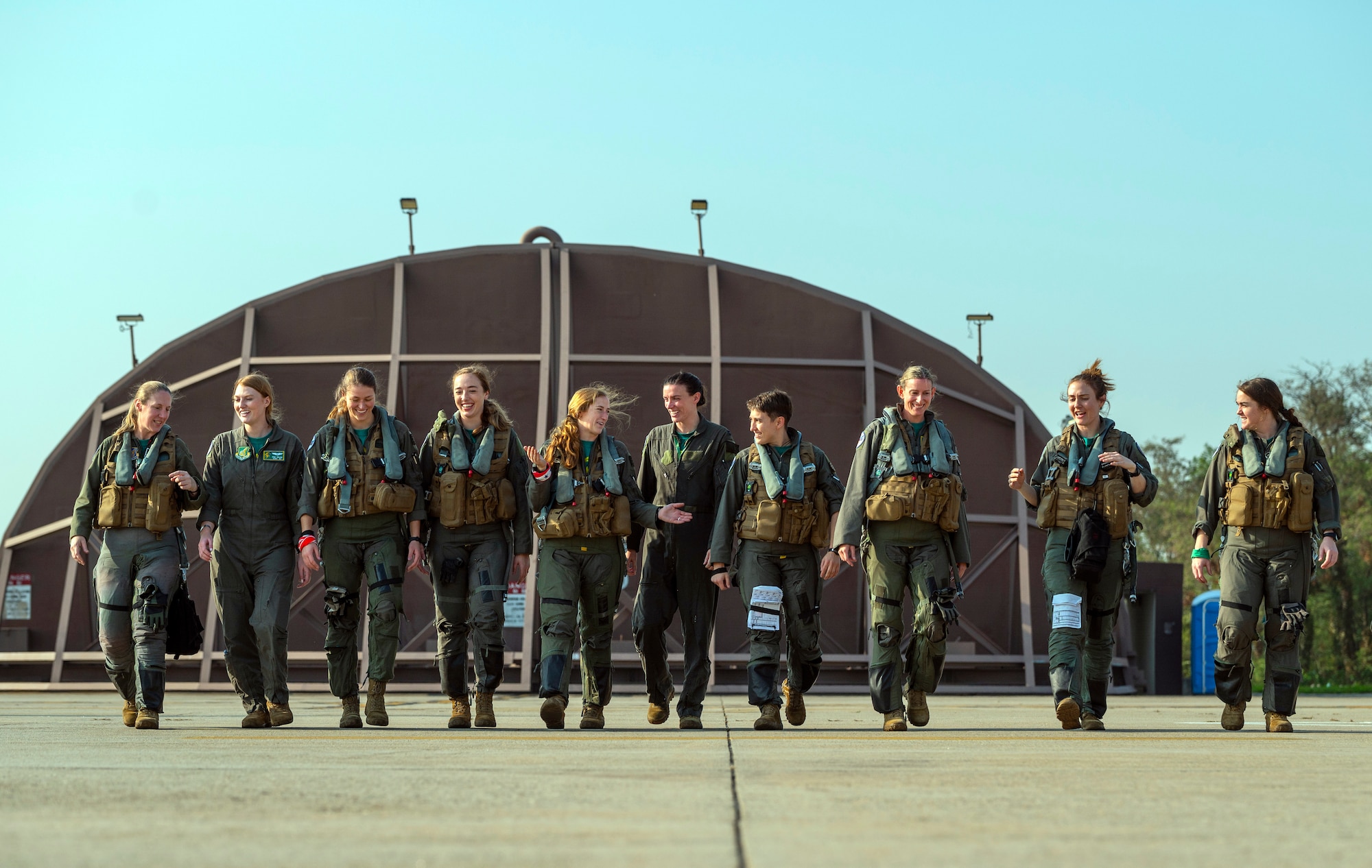Female fighter pilots assigned to the 36th and 25th Fighter Squadrons join together before flying
