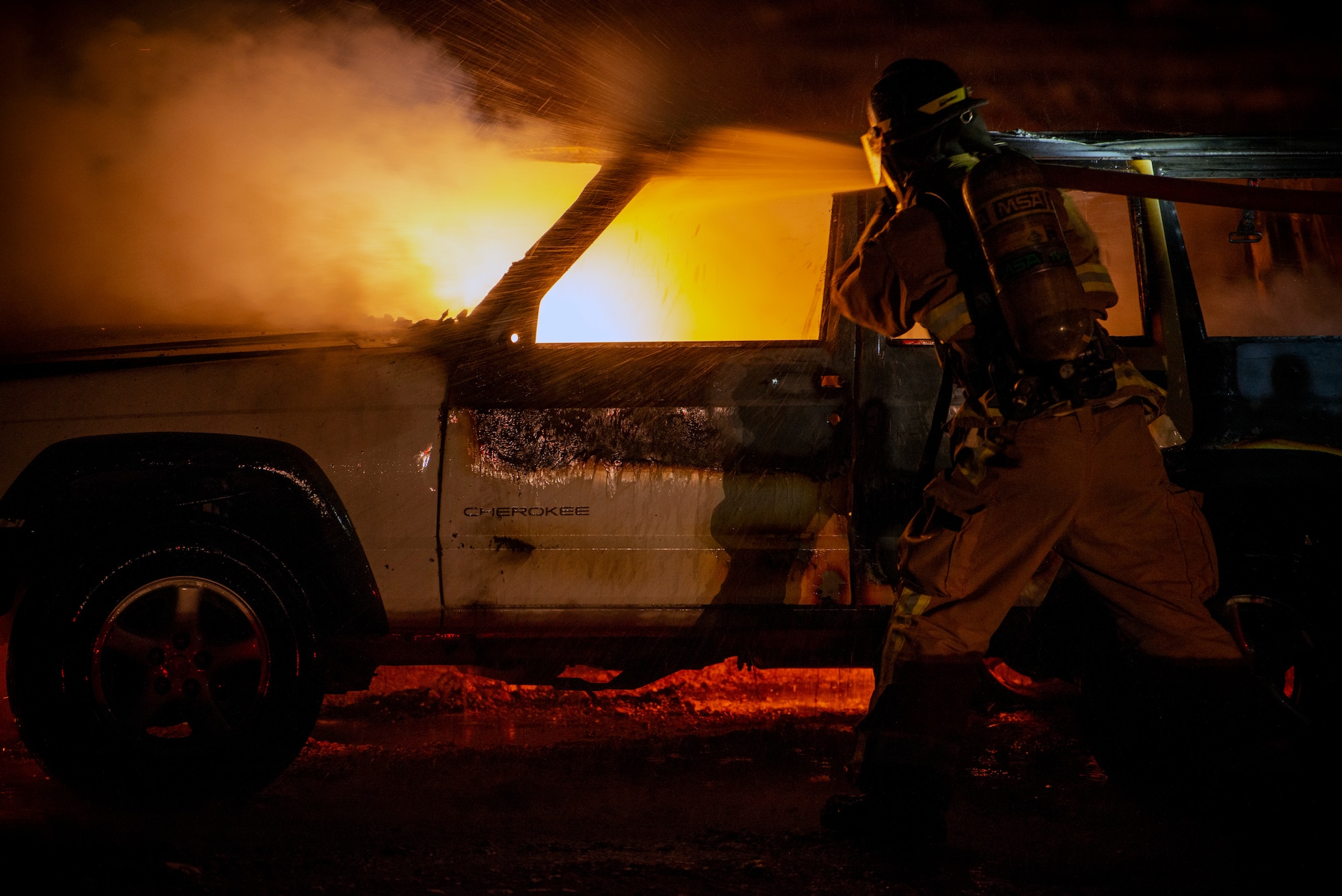 U.S. Air Force Airman 1st Class Javon Coleman extinguishes a fire