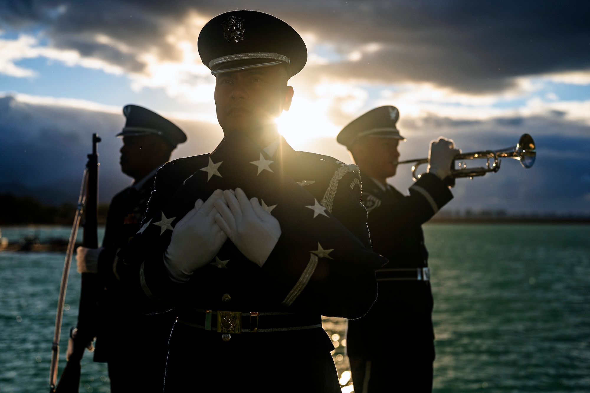 Tech. Sgt. Darrell Bactad, Capt. Kalani Guillermo, and Master Sgt. Russell Mesinas, members of the Hawaii Air National Guard’s Honor Guard, display various ceremonial military honors