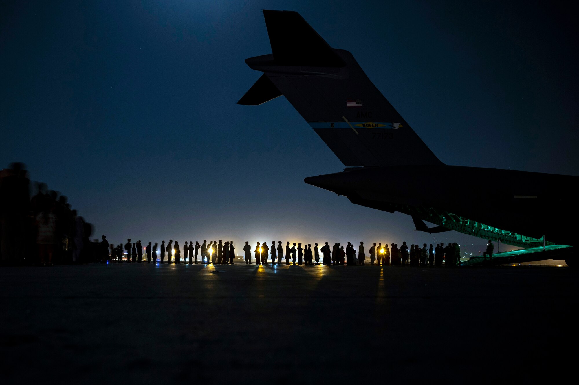 Afghanistan evacuees board a C-17