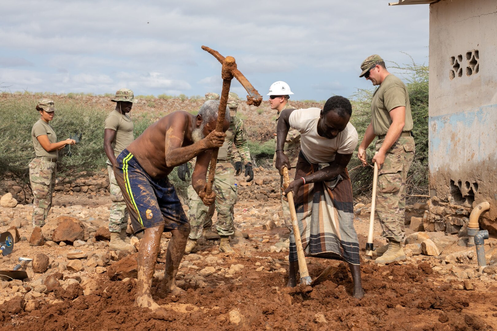 Djiboutians and U.S. Soldiers dig out a broken pipe at Chabelley Village, Djibouti, Dec. 22, 2021. Combined Joint Task Force – Horn of Africa engineers, including Soldiers from the 712th Engineer Support Company, worked alongside villagers to restore the village’s source of drinking water.