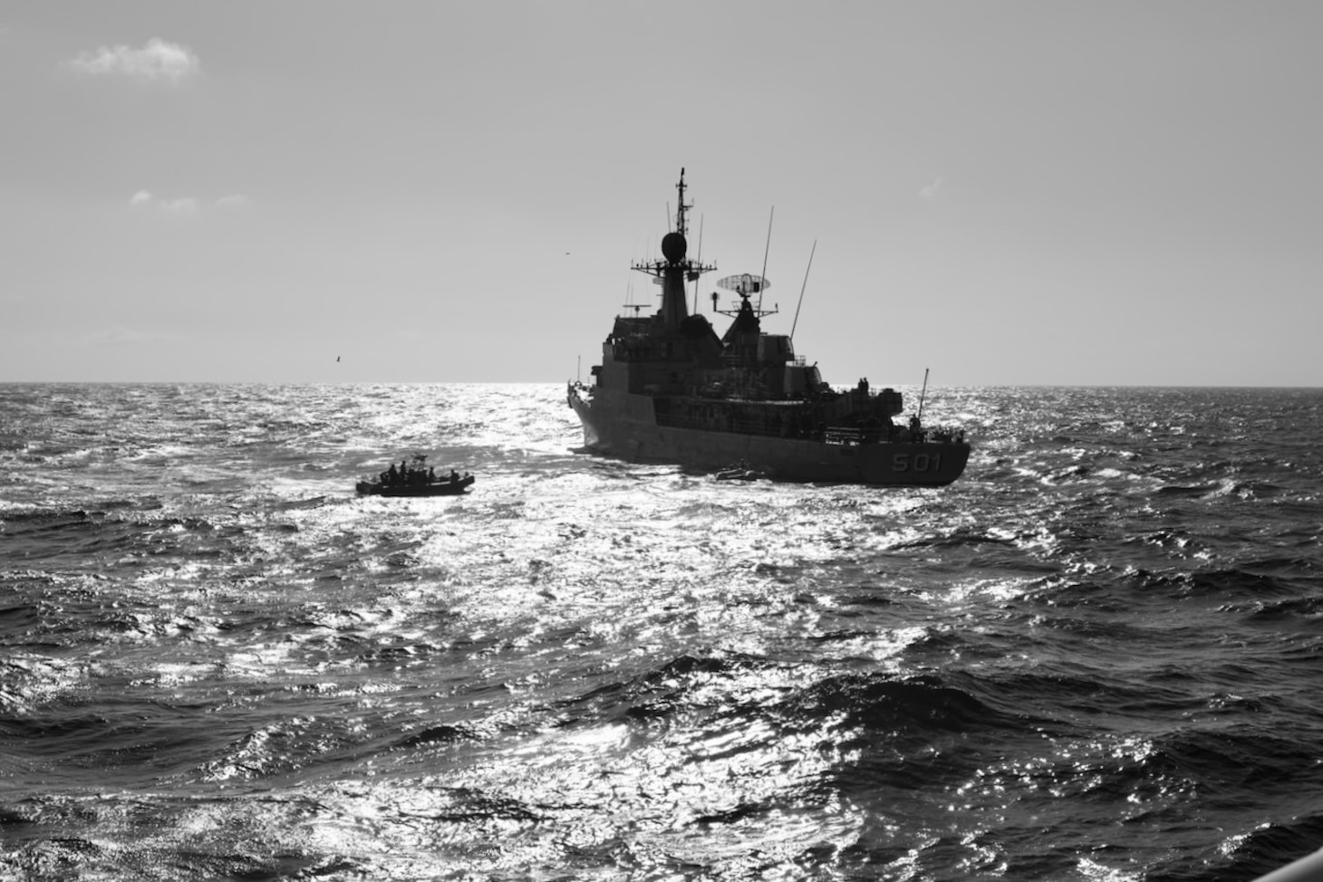 The crew of the Sentinel-class USCGC Glen Harris (WPC 1144) transfer rescued migrants to a Royal Moroccan Navy ship in the Atlantic Ocean Jan. 5, 2021.