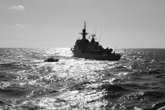The crew of the Sentinel-class USCGC Glen Harris (WPC 1144) transfer rescued migrants to a Royal Moroccan Navy ship in the Atlantic Ocean Jan. 5, 2021.