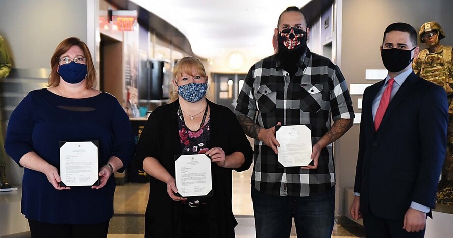 Matt Sannito, deputy to the commanding general, ASC, presented congratulatory letters to Brandi Gregoire, Jodie Wesemann, and Dan Redman Dec. 2 at ASC headquarters.