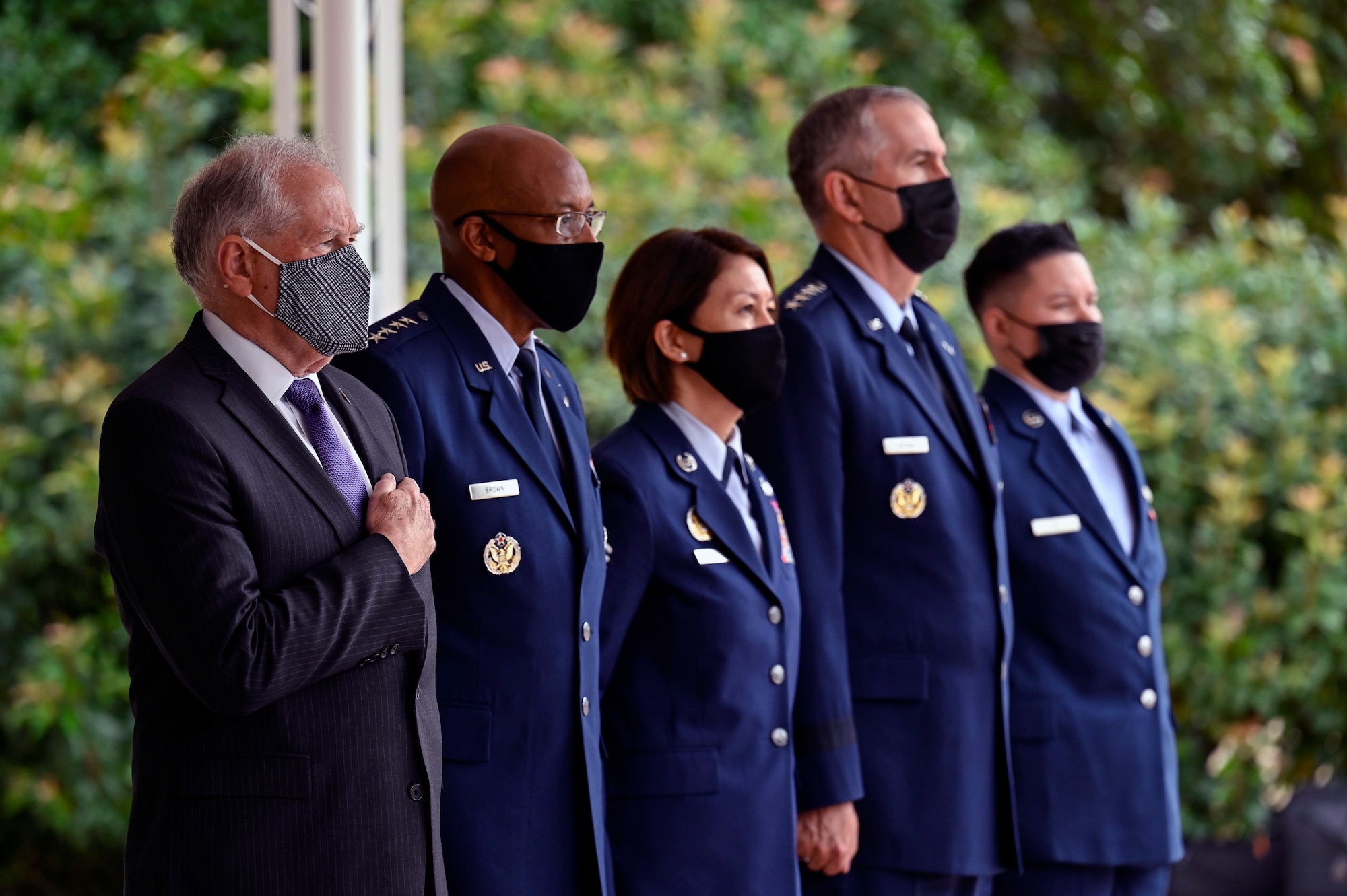 Secretary of the Air Force Frank Kendall, Air Force Chief of Staff Gen. CQ Brown, Jr., Chief Master Sgt. of the Air Force JoAnne S. Bass, Gen. John E. Hyten, vice chairman of the Joint Chiefs of Staff and Senior Airman Alexis Hill, the youngest Airman present, stand at attention for the national anthem