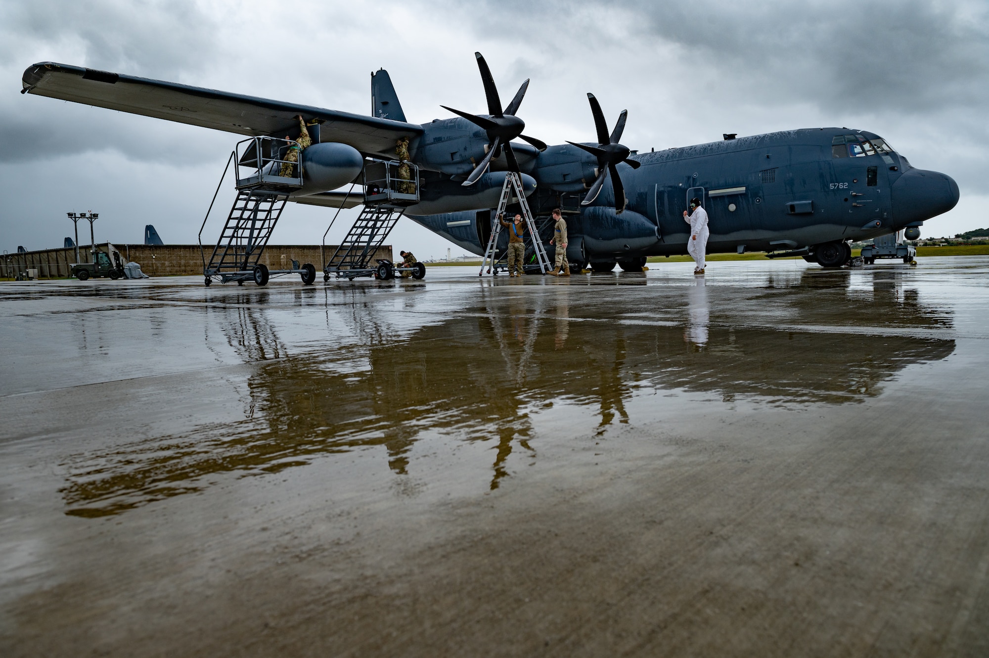 Airmen conduct pre-flight checks.