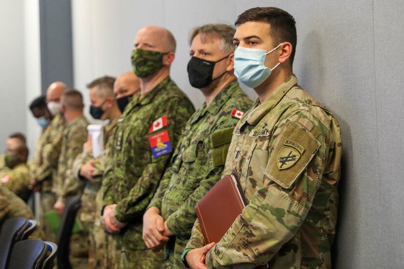 Chaplains from the U.S. Army Civil Affairs and Psychological Operations Command (Airborne) and  Canadian Army observe fellow Soldiers as they brief area assessments during their evaluated briefings at the Combined Religious Area Assessment and Chaplain Religious Leader Engagement training held November 16—19, 2021, at Fort Jackson, South Carolina.