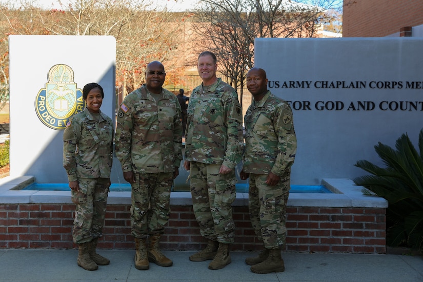 (left to right) U.S. Army Reserve Soldiers Sgt. 1st Class Monika Patterson; Chaplain (Lt. Col.) Richard James; Chaplain (Maj.) Joshua Cox; and Master Sgt. Joe Burch; U.S. Army Civil Affairs and Psychological Operations Command (Airborne) unit ministry team; gather outside the U.S. Army Chaplain Center and School; Fort Jackson; South Carolina. The USACAPOC(A) team was instrumental in developing the Combined Religious Area Assessment and Chaplain Religious Leader Engagement training; held November 16—19; 2021; which involved UMTs from across the command as well as Chaplains from the CanadianArmed Forces.