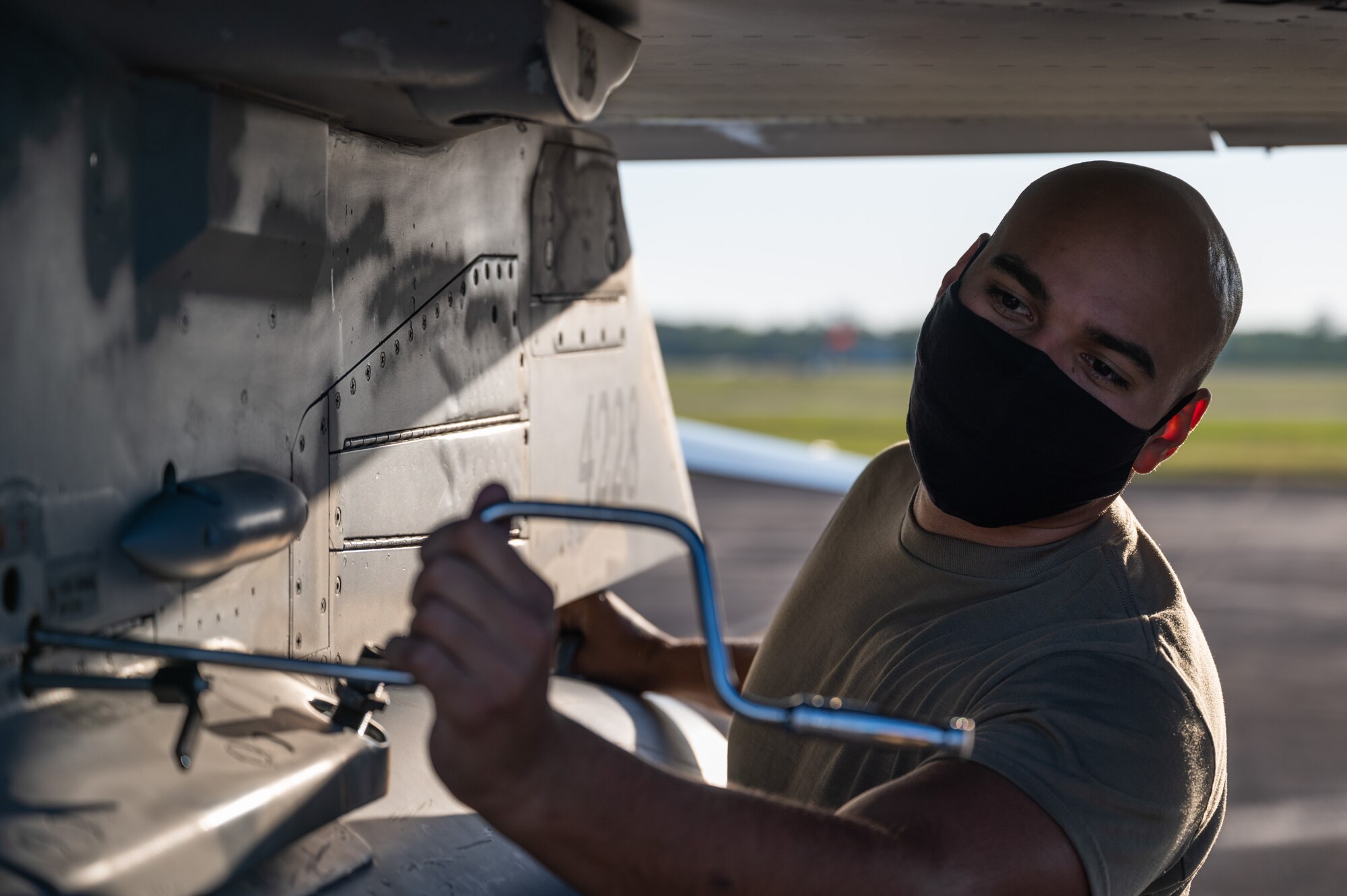 Technical Sgt. Chad Wright of the 162nd Wing, Arizona Air National Guard, performs maintenance on an F-16 fighter aircraft while deployed to Naval Air Station Joint Reserve 
Base New Orleans, for operation Southern Lightning Strike 2021, November 2. Southern Lightning Strike is an Air National Guard led exercise where units deploy from their home bases to forward operating bases with minimum personnel and equipment to accomplish the mission in austere conditions. (U.S. Air National Guard Photo by Technical Sgt. H. Edward Stramler)