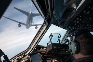 Over the Gulf of Mexico near New Orleans, Maj. David Hutchins, a C-17 instructor pilot from the 183rd Airlift Squadron, 172nd Airlift Wing, Mississippi Air National Guard, aligns his aircraft for air-to-air refueling with a KC-46 tanker aircraft of the 157th Air Refueling Wing, New Hampshire Air National Guard, November 3. The mission is in support of Operation Southern Lightning Strike 2021, an Air National Guard led exercise where units deploy from their home bases to forward operating bases with minimum personnel and equipment to accomplish the mission in austere conditions. (U.S. Air National Guard Photo by Technical Sgt. H. Edward Stramler)