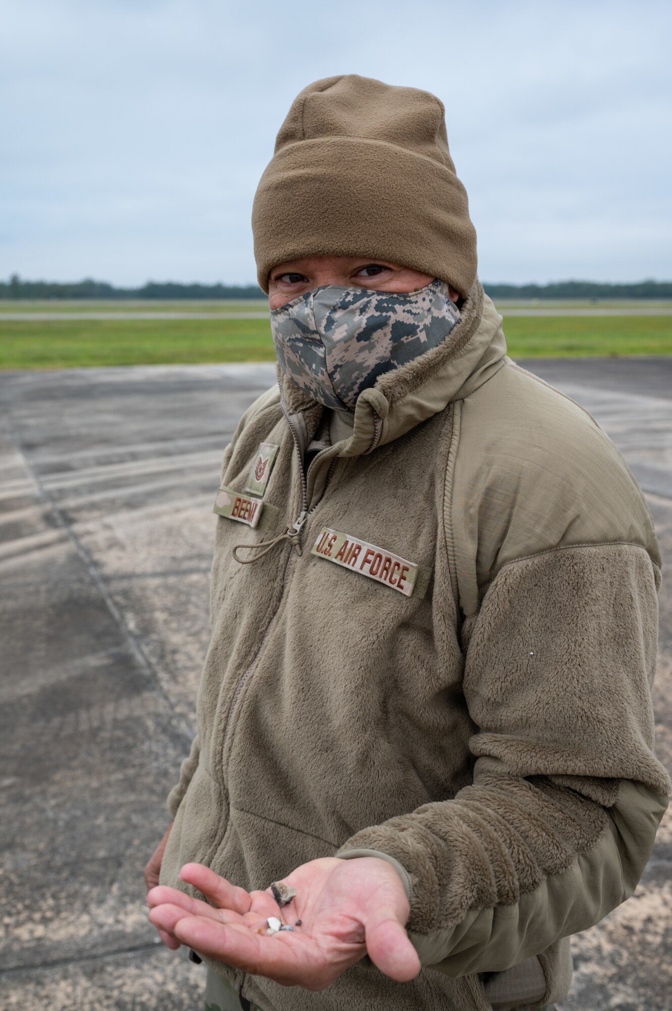 While preparing to launch F-16 fighter aircraft during Operation Southern Lighting Strike, Tech. Sgt. Troy Beeman of the 162nd Wing, Arizona Air National Guard, displays the debris that he picked during the daily F.O.D. (foreign object damage) walk at Naval Air Station Joint Reserve Base New Orleans, November 5. Airmen look for and collect any loose items on the flight line that could damage the engines of the F-16 fighter aircraft that they maintain. (U.S. Air National Guard Photo by Technical Sgt. H. Edward Stramler)